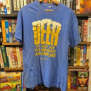 VINTAGE 80s SINGLE STITCH DISTRESSED FADEDBlue Graphic T-Shirt with Yellow Print